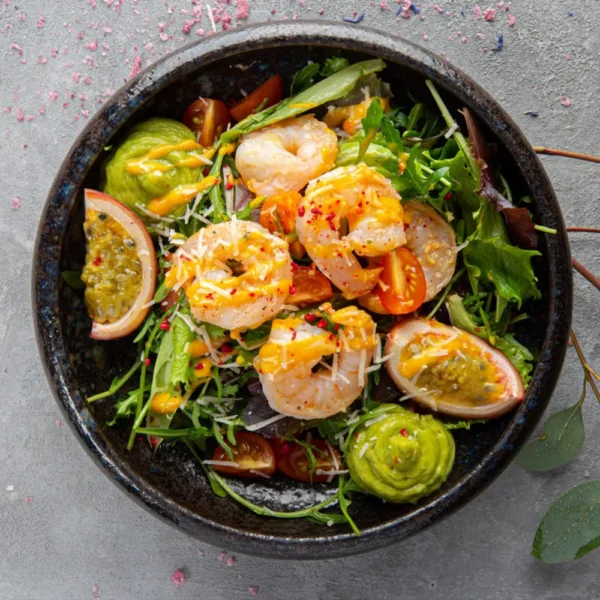 Fresh salad with tiger shrimp, guacamole